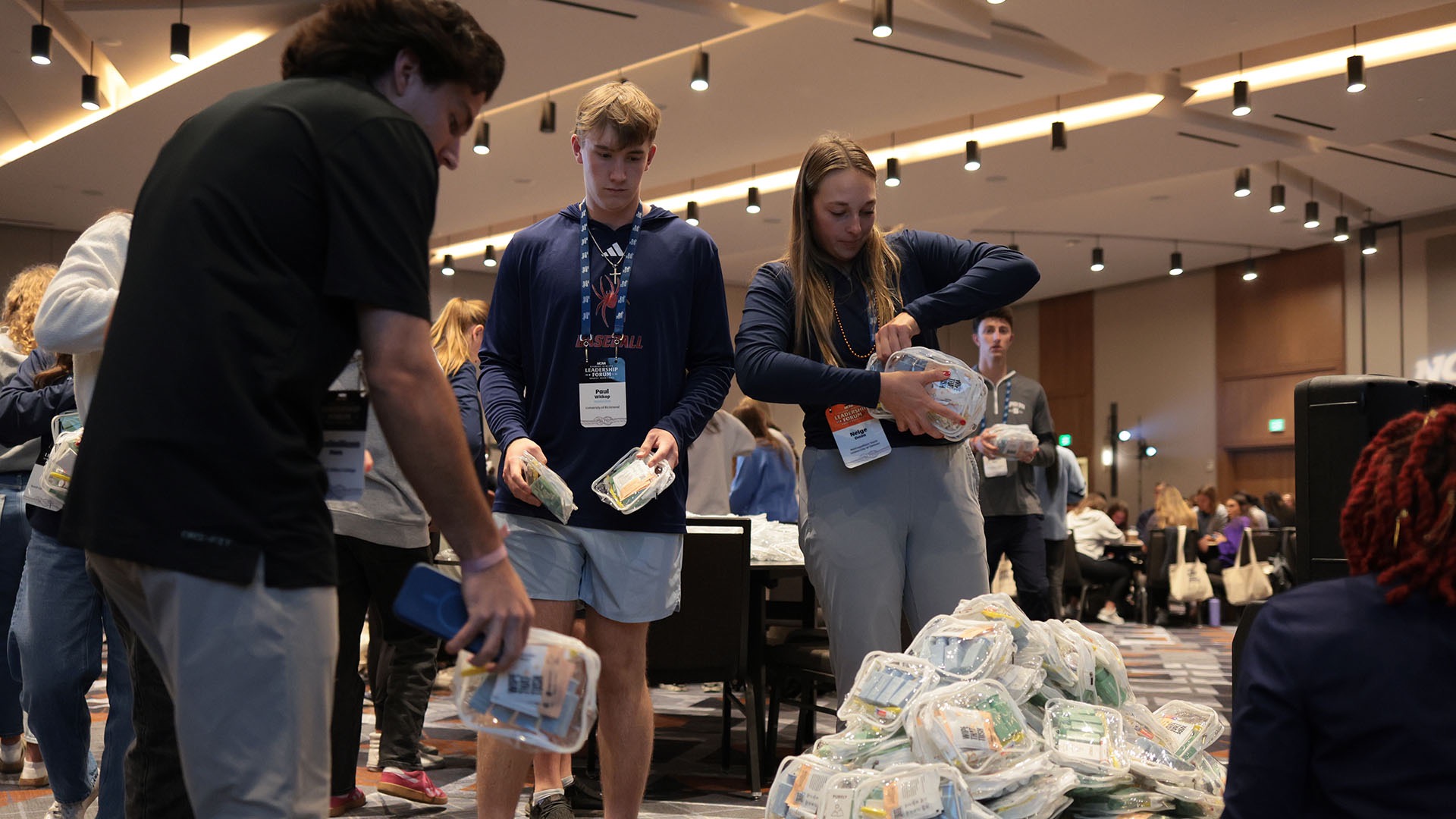 Student-athletes packed care packages and filled notebooks with words of encouragement for residents of Genesis Women's Shelter and Support in Dallas.