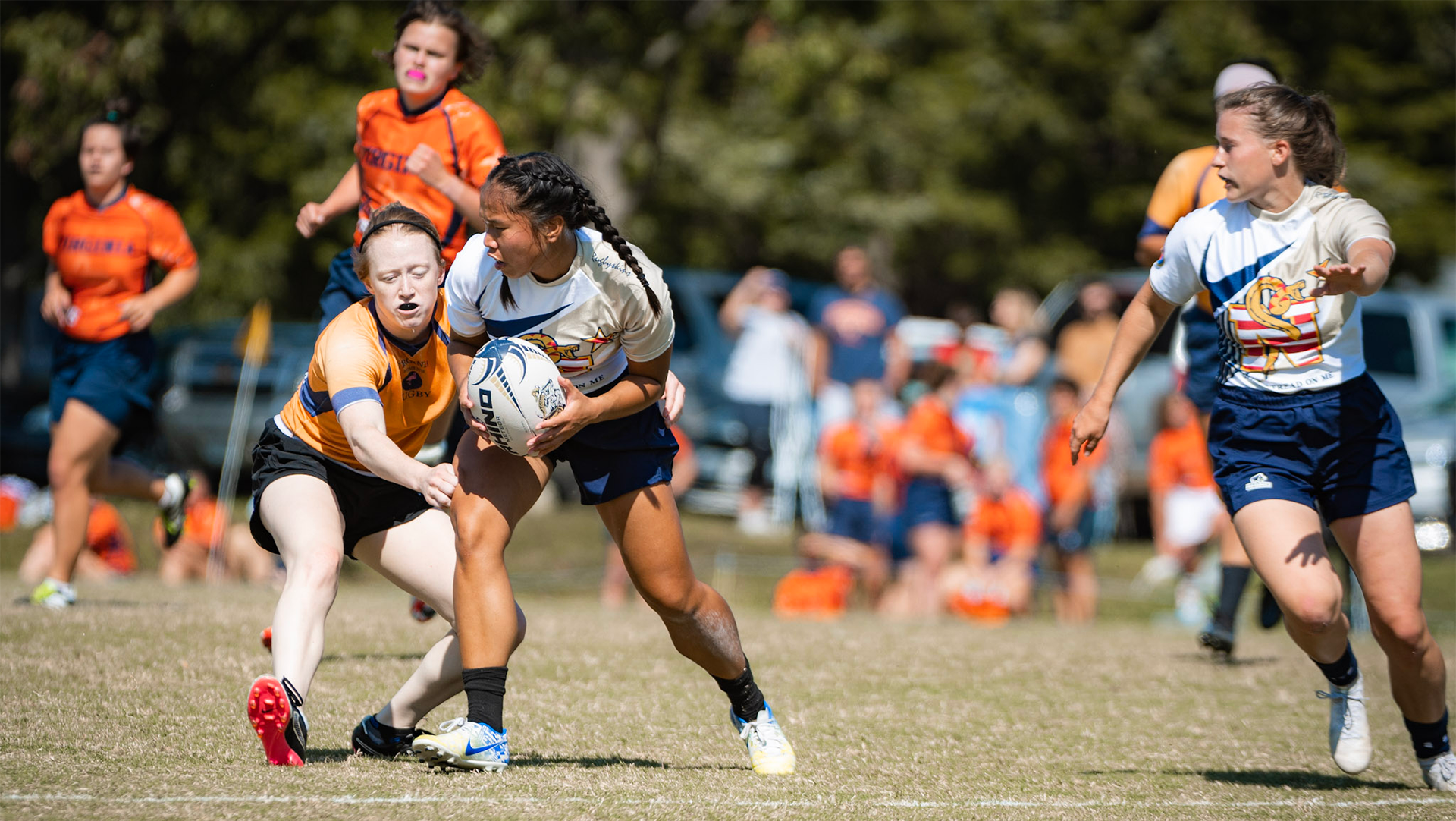 Ward (left) had never played rugby before getting to Navy. The team became family for Ward, and the sport added a rewarding break into a day filled with academic and physical training. (Photos courtesy of Abigail Ward) 