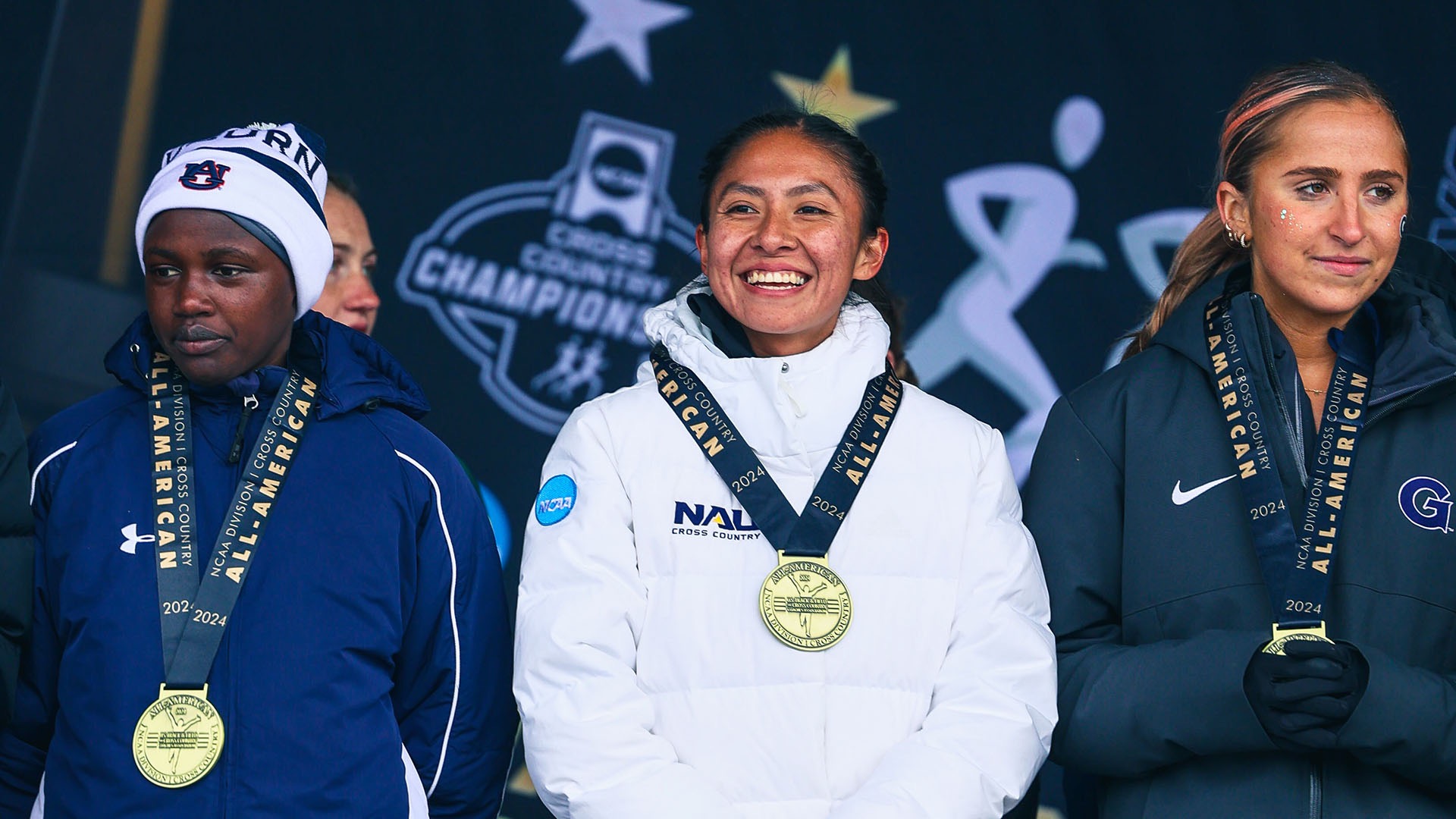 Upshaw sports her All-America medal at the 2024 NCAA Division I Women's Cross Country Championships.
