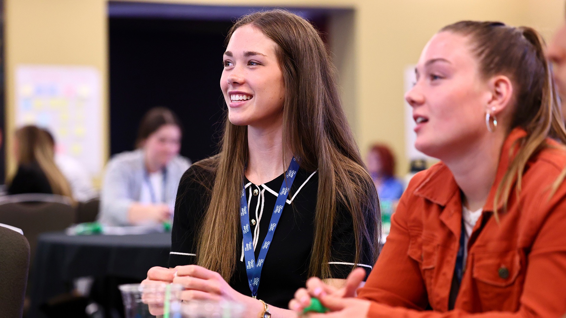 Grace Hanel, who was on the Sioux Falls volleyball team, listens to her campsite facilitators during a breakout session