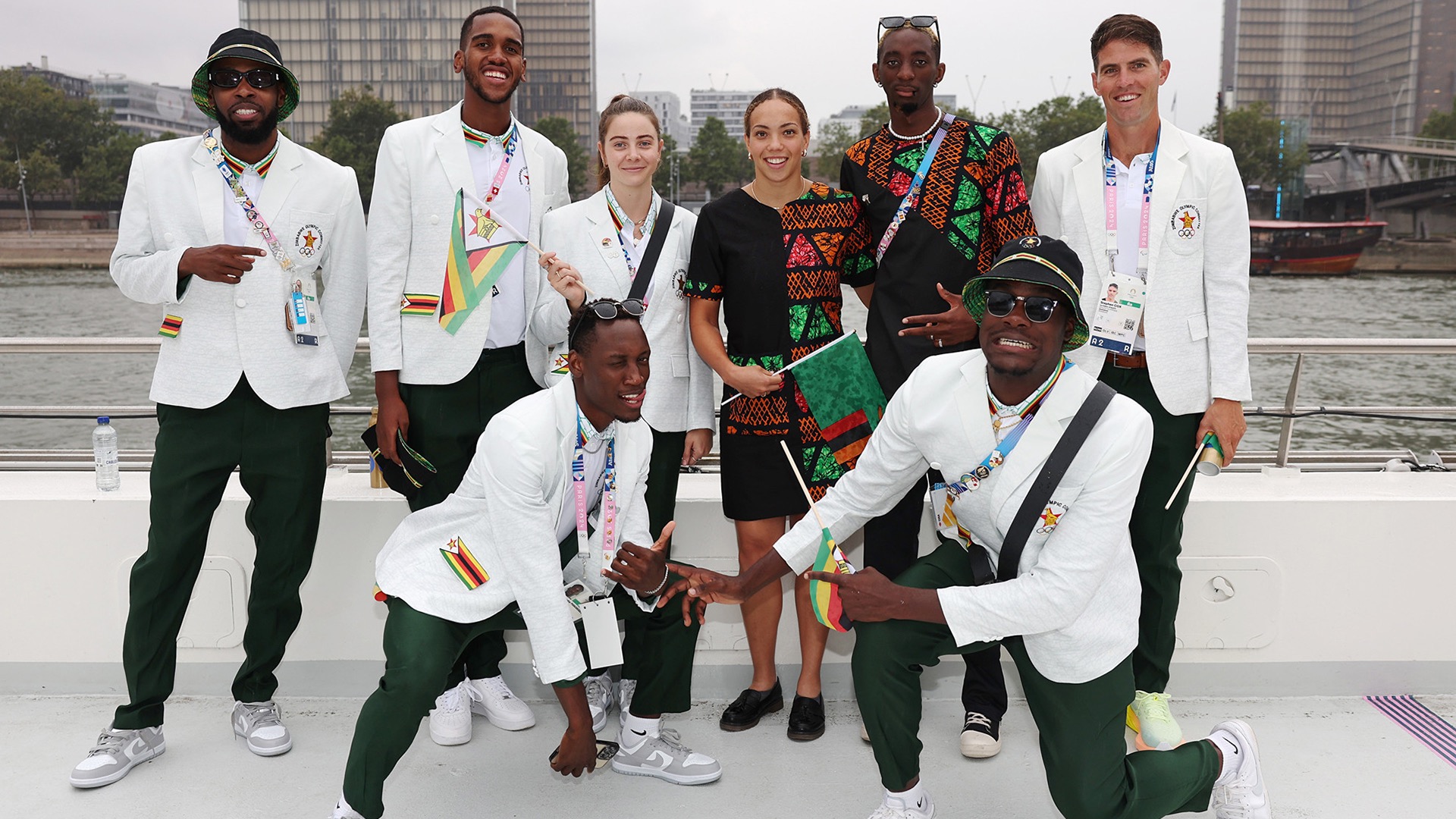 Maka, bottom right, bore Zimbabwe's flag during Opening Ceremonies