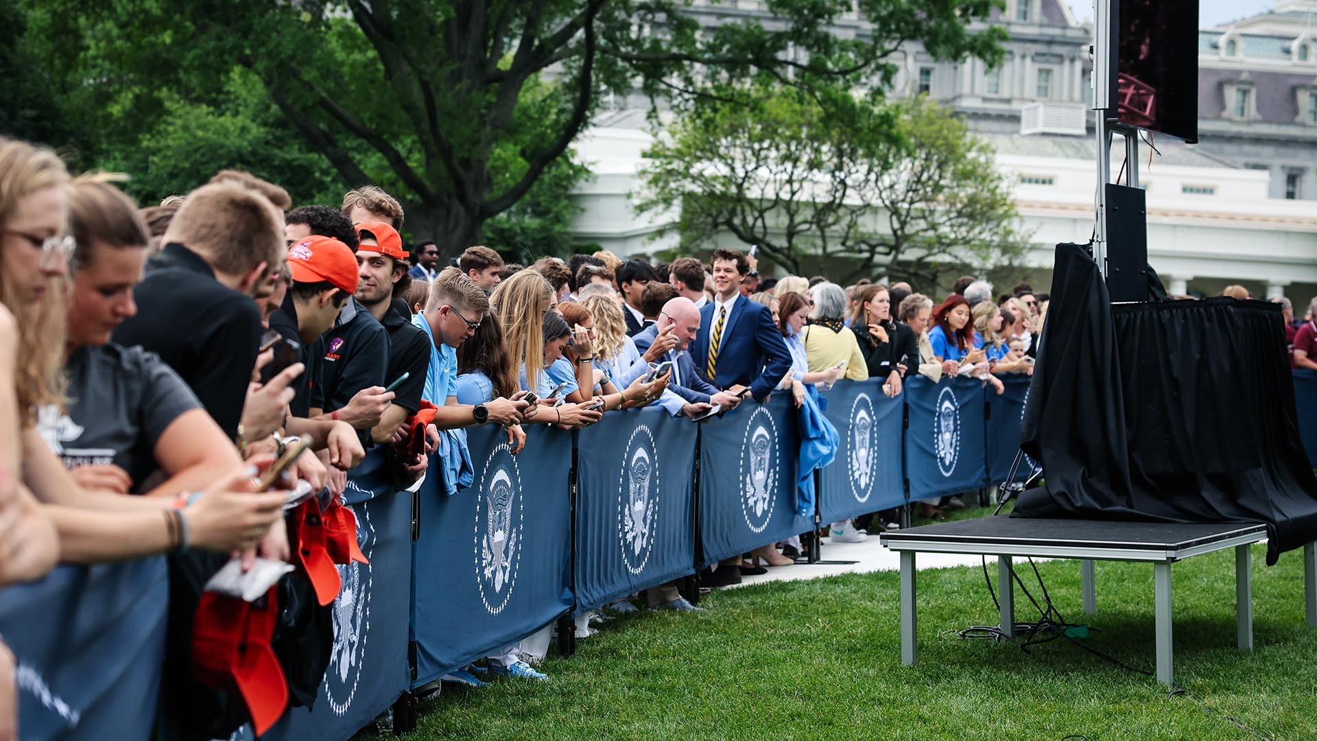 This is a photo of attendees in front of the White House for College Athlete Day on June 12, 2023.