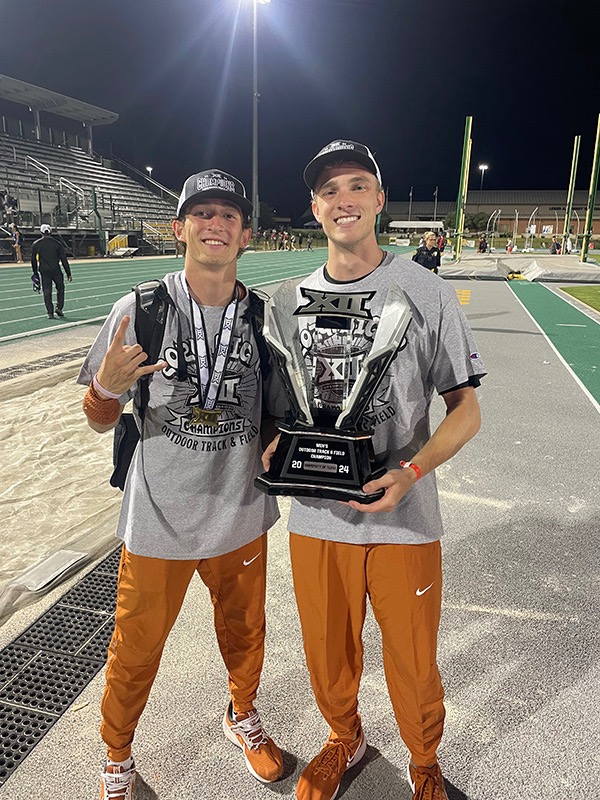 Cooper Tyler with Big XII Championship Trophy