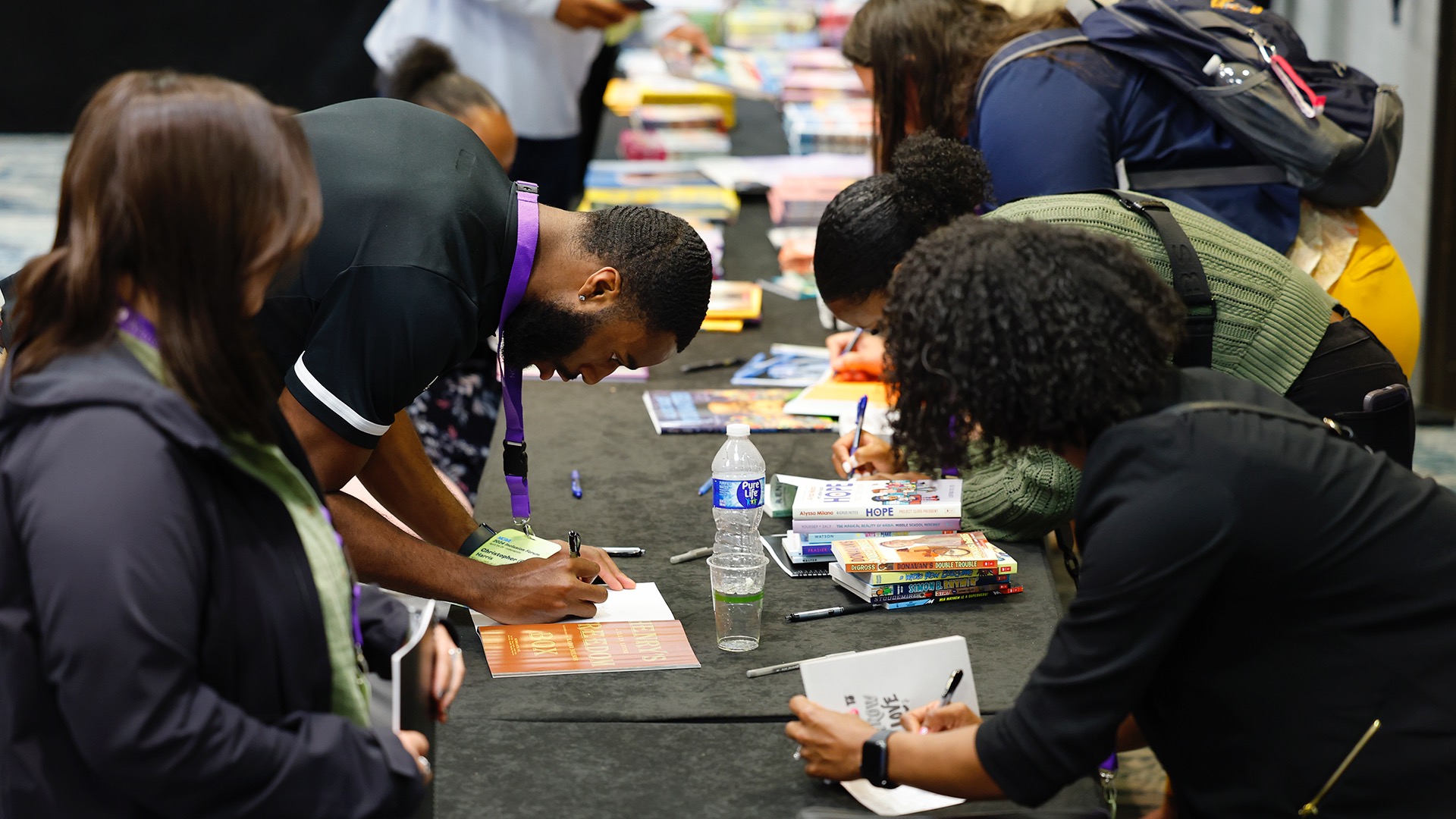 Attendees at the 2024 Inclusion Forum provided notes of encouragement inside books related to diversity, equity, inclusion and belonging as part of a community service project