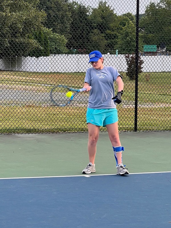 To keep Loiseau in high spirits during strenuous physical therapy, her doctors incorporated a tennis racket into her training. Eventually, Loiseau returned to the court.