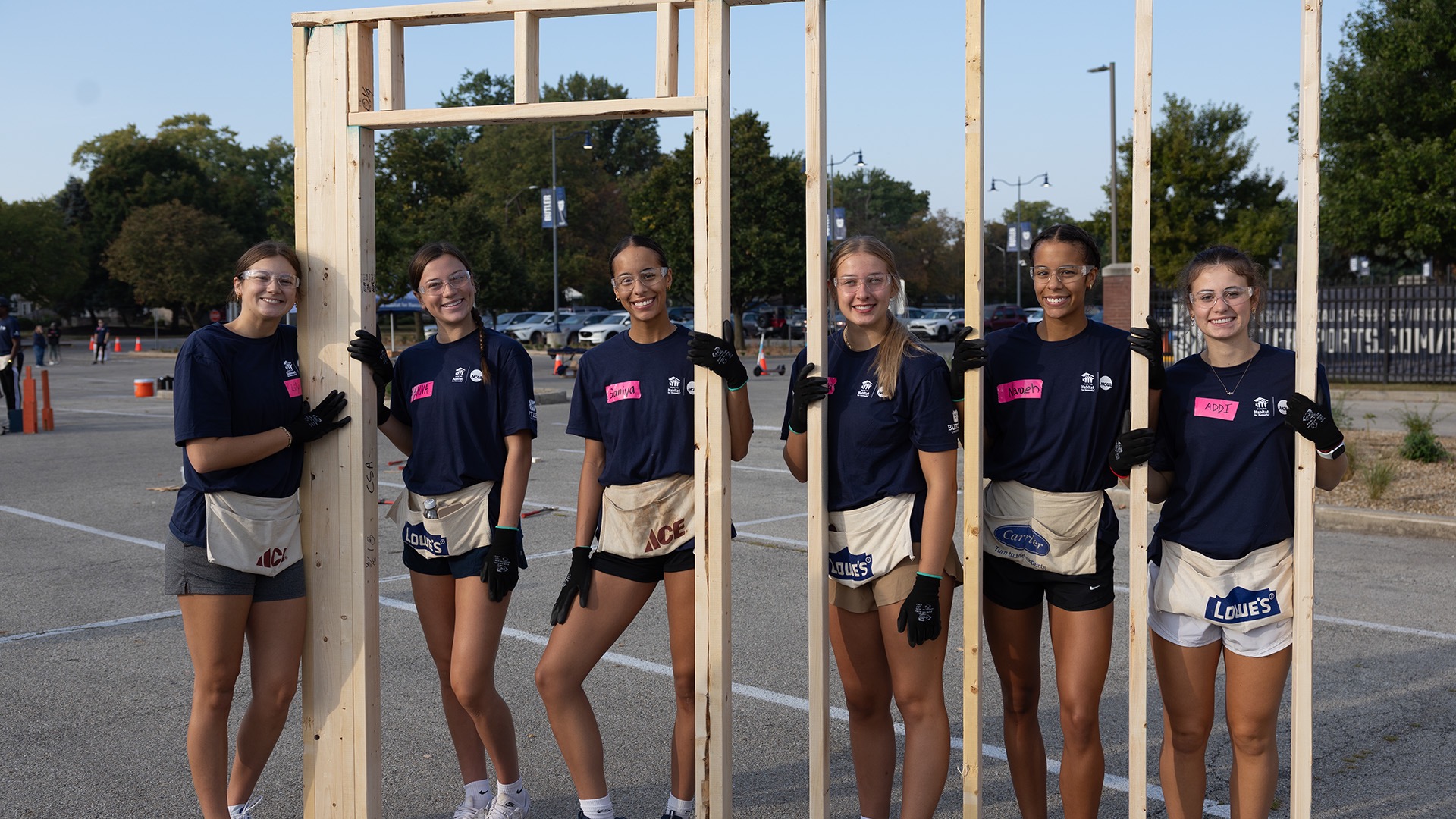 Saniya Jackson (third from the left) and her teammates pose in one of the panels. Members of the men's and women's basketball teams and the baseball, lacrosse and cheer teams volunteered for 2½-hour shifts.