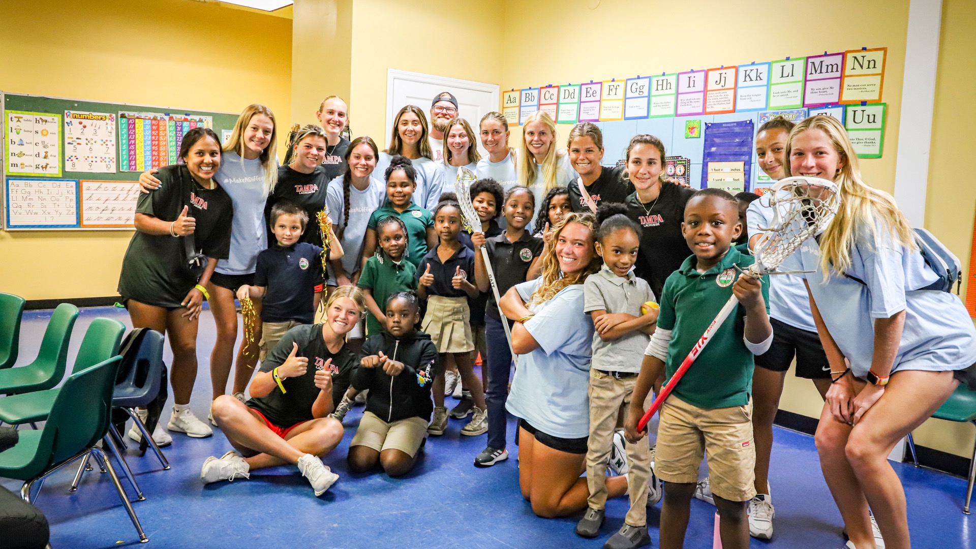 At the Future Leaders Christian Academy in Orlando, the Tampa women's lacrosse team introduced the sport to many who had never played it. (Photo by Navraj Sandhu)