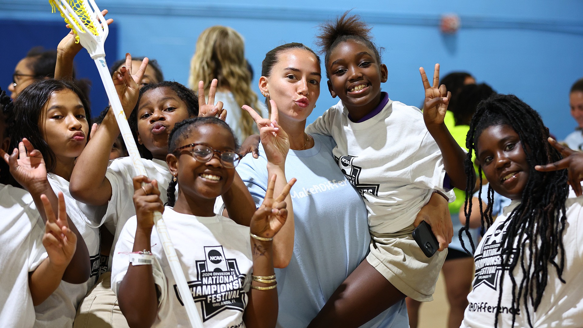 The Adelphi women's lacrosse team visits the Boys and Girls Club during the 2024 NCAA Division II Championships Festival in Orlando, FL. Jamie Schwaberow/NCAA Photos