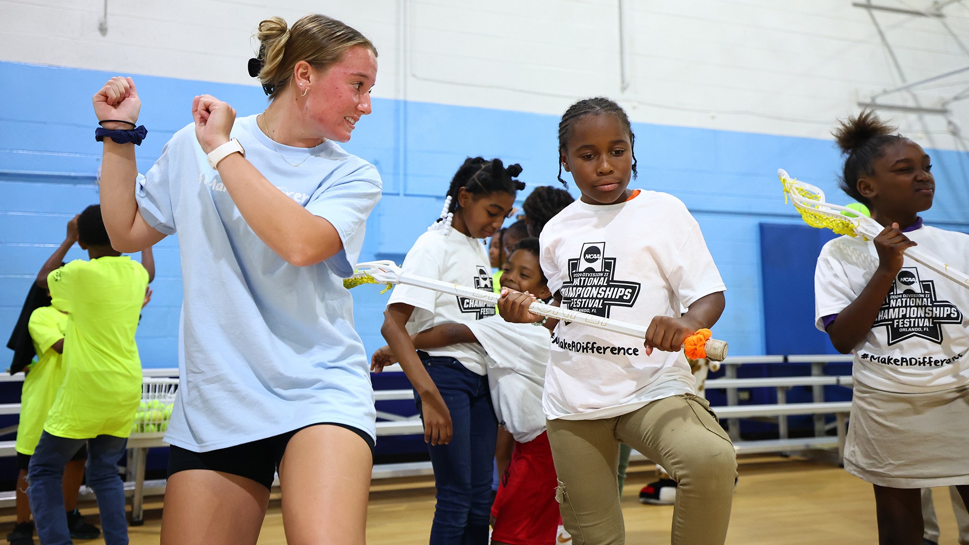 The Adelphi women's lacrosse team visits the Boys and Girls Club during the 2024 NCAA Division II Championships Festival in Orlando, FL. Jamie Schwaberow/NCAA Photos