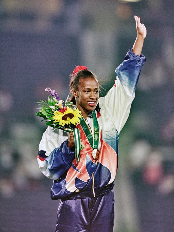 Jackie Joyner-Kersee receives the bronze medal in the long jump at her last Olympic Games in 1996.