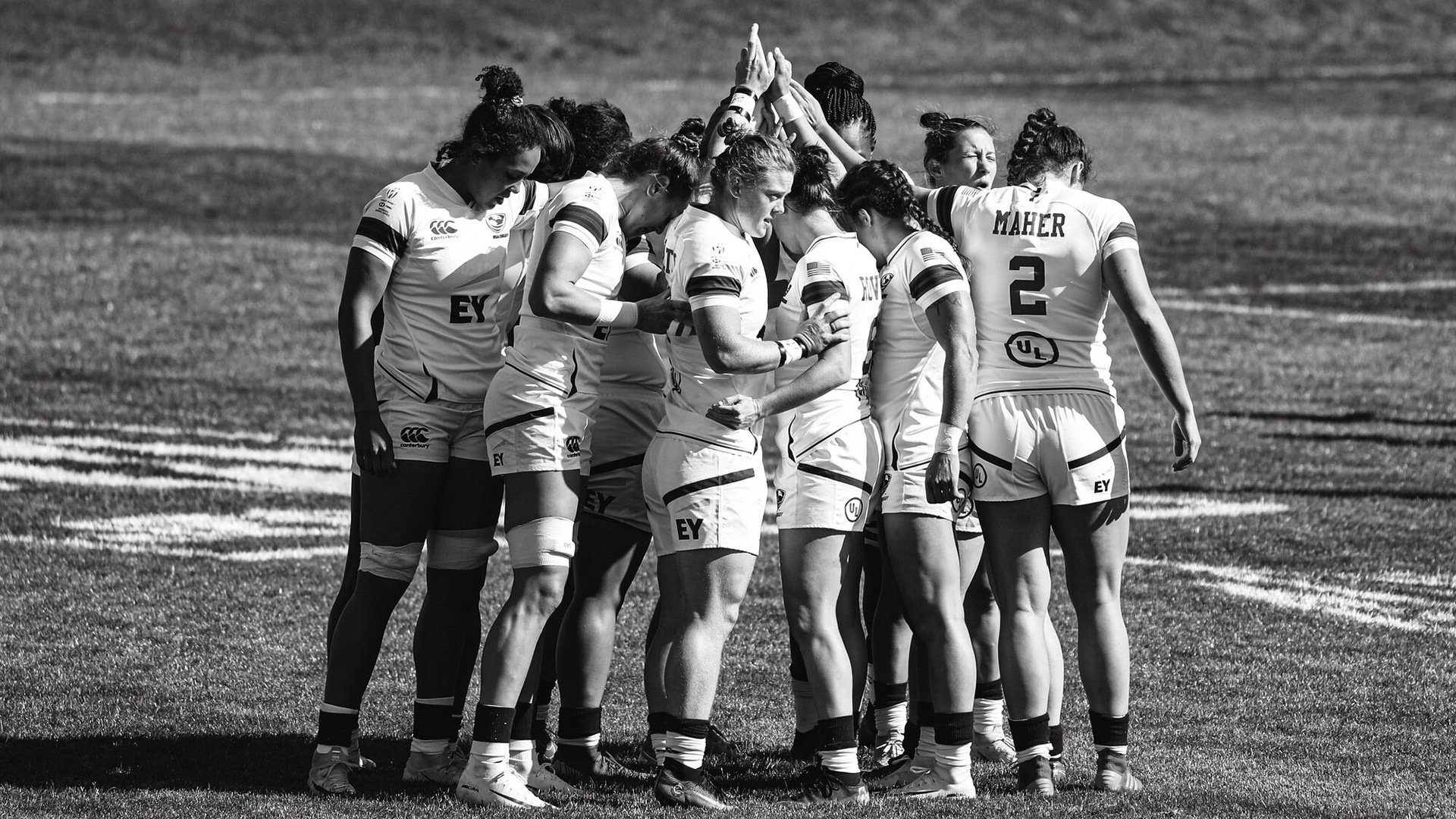 Kelter huddles with her rugby teammates who have helped her redefine her identity as an athlete.