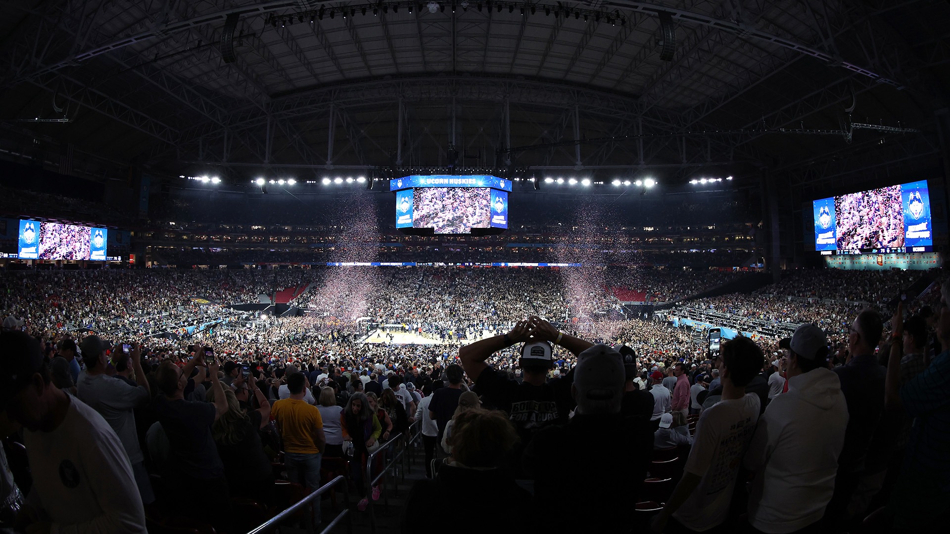 GLENDALE, ARIZONA - APRIL 08: Connecticut Huskies celebrate after defeating the Purdue Boilermakers in the NCAA Men's Basketball Tournament National Championship game at State Farm Stadium on April 08, 2024 in Glendale, Arizona. (Photo by Alysa Rubin/NCAA Photos via Getty Images)