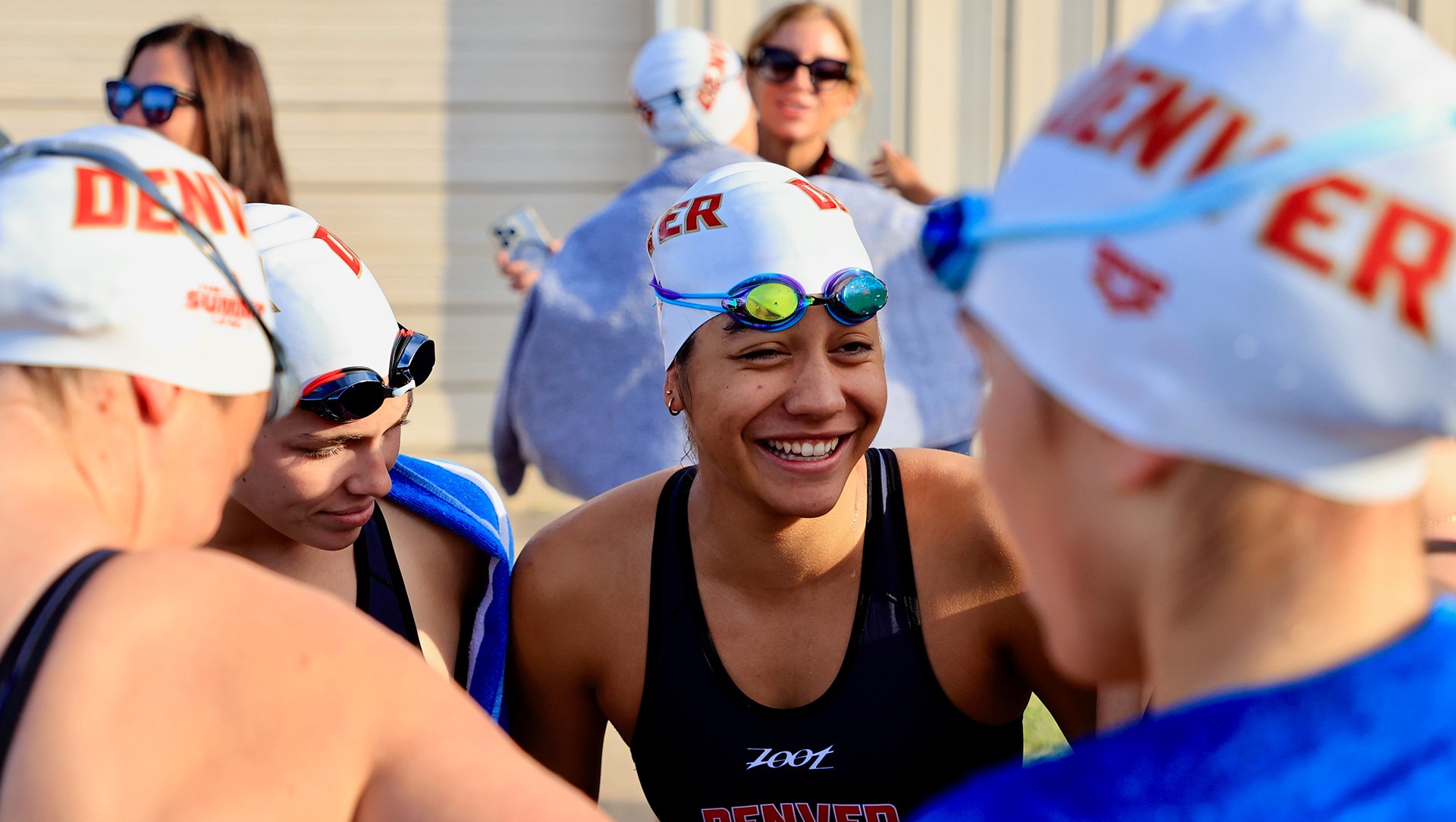Carreau shares a moment with her teammates before a triathlon meet.