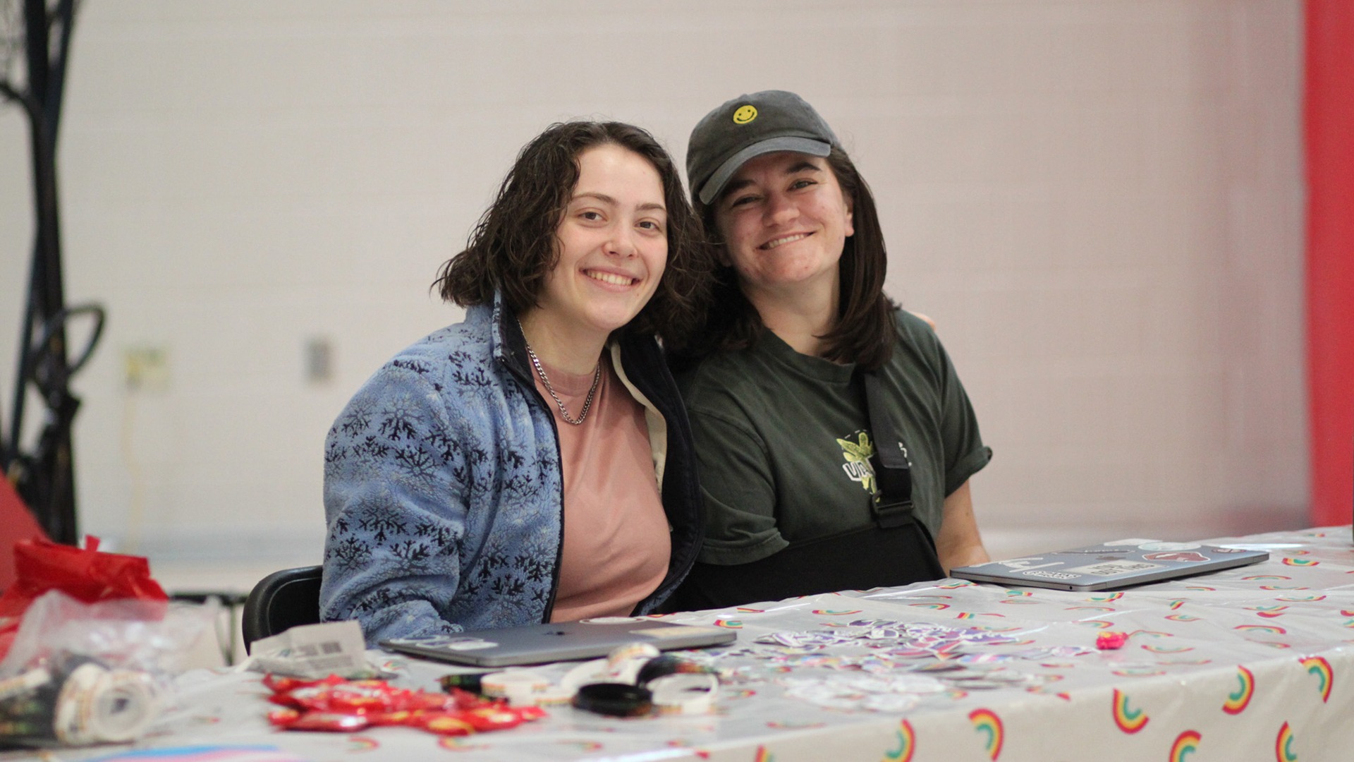 Smith (right) volunteers at a Pride event for the Play with Pride organization.