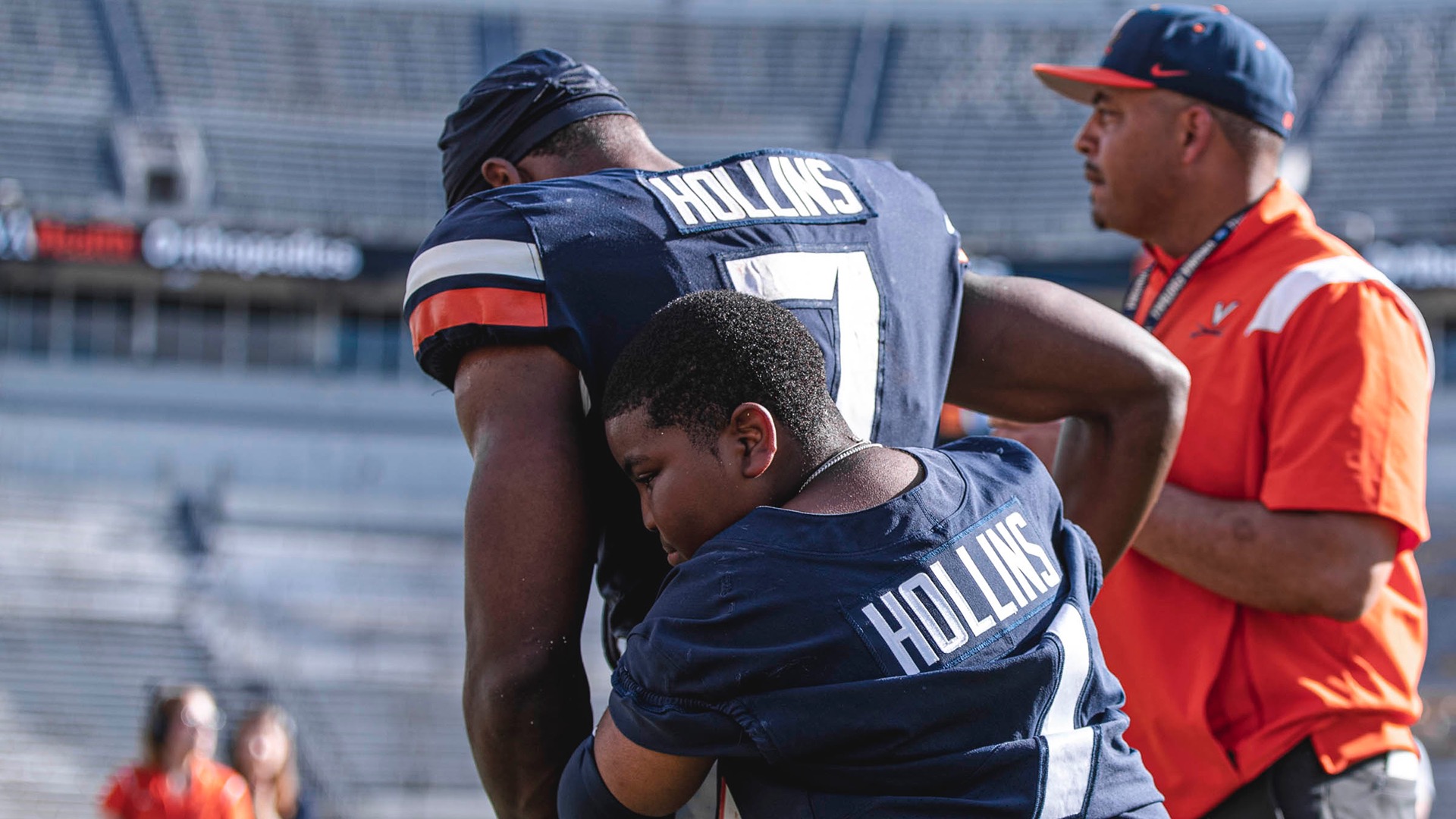 Hollins' brother, Deuce, supports him in his first game back after the shooting. (Photo courtesy of Emily Morgan / Virginia Communications)