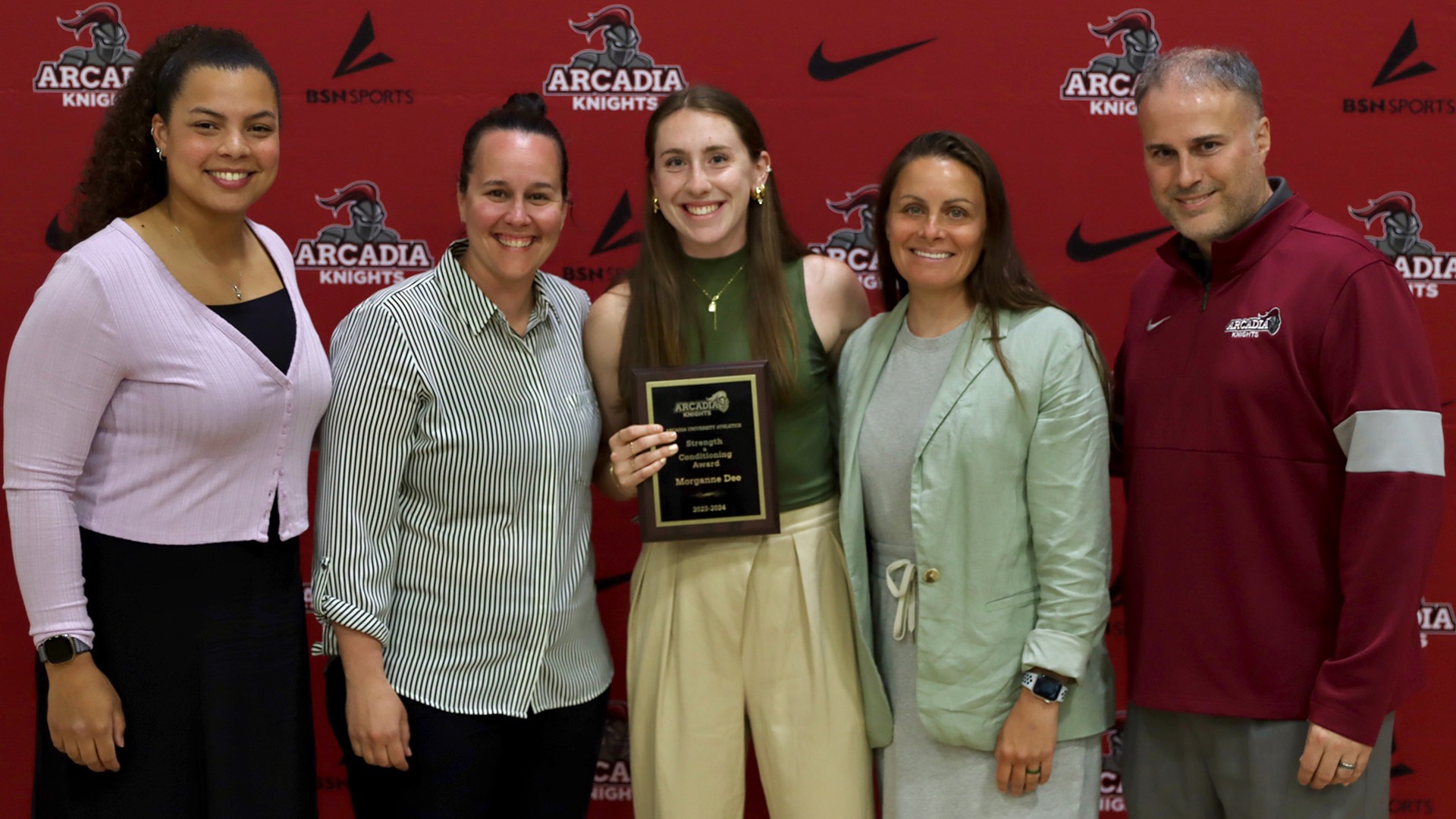 Dee is pictured with her coaches at the 2024 Arcadia athletics award ceremony, where Dee earned Athlete of the Year and Strength and Conditioning Athlete of the Year honors.