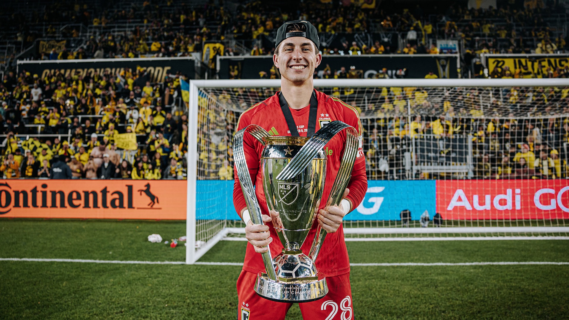 Patrick Schulte holding the 2023 MLS Cup