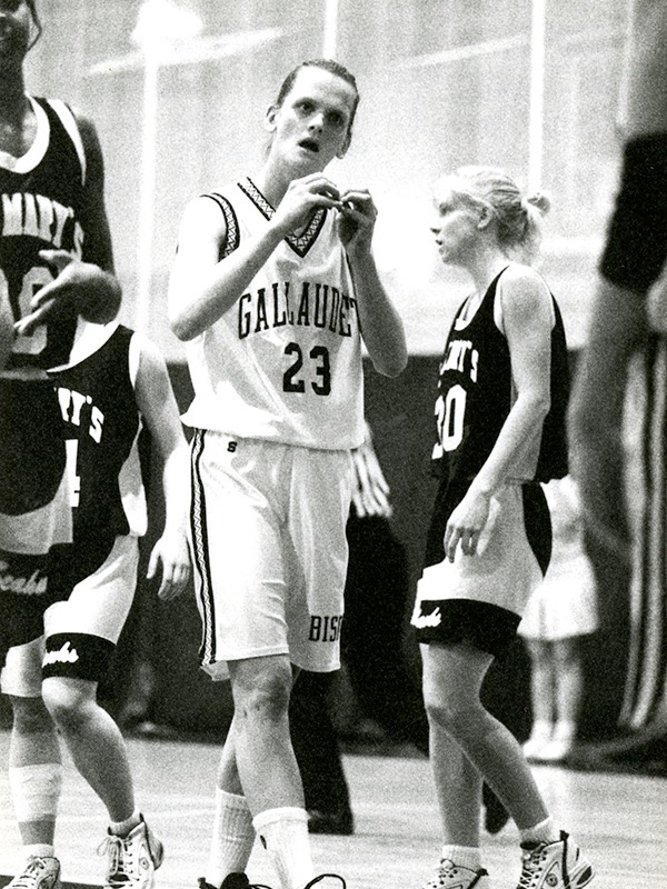Miller signs to a teammate during a stoppage of play. Gallaudet, a university for deaf and hard of hearing students, allowed Miller to have consistent communication with her teammates and coaches.