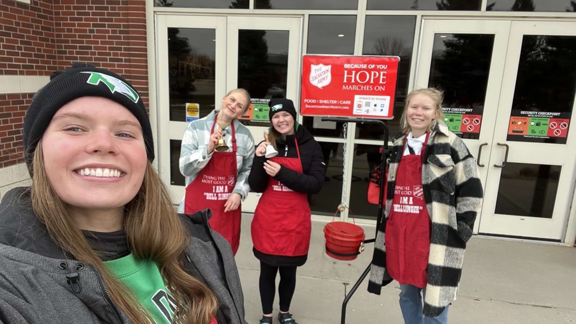 North Dakota women's track and field and cross country student-athletes volunteer as bell ringers for the Salvation Army.