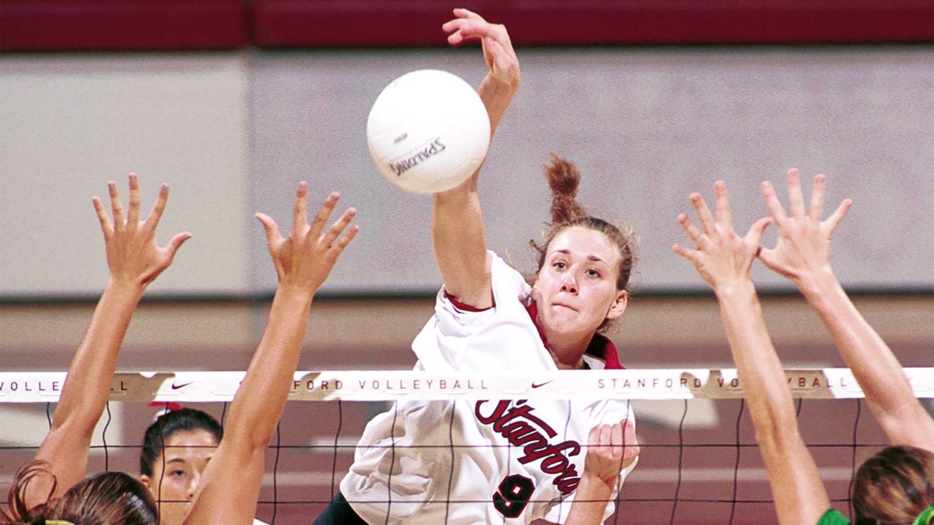 In her career at Stanford, she was named a first-team American Volleyball Coaches Association All-American four times. She became the first player in Pac-10 history to surpass 1,500 career kills, 1,200 digs and 500 blocks, earning co-National Player of the Year honors in 1999. (Photo courtesy of Stanford)