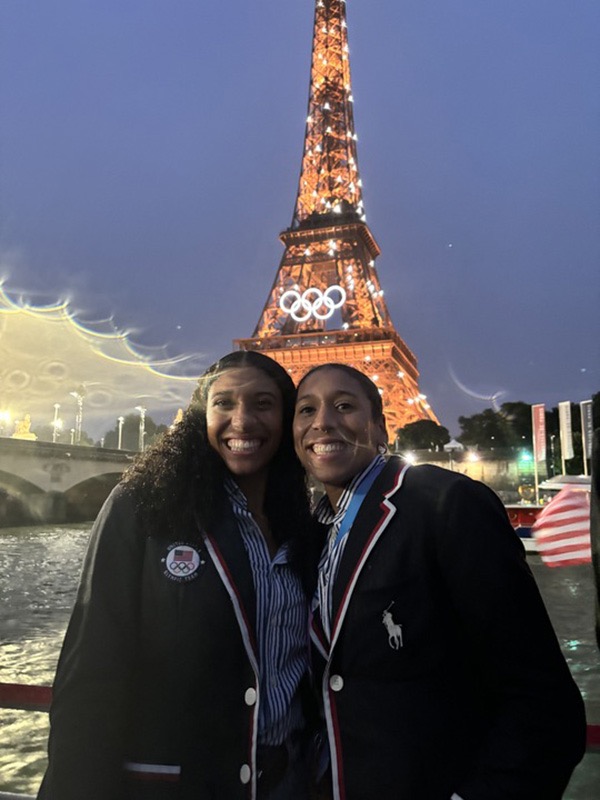 Juliette and Bella Whittaker share a moment in front of the Eiffel Tower. About 20 family members flew to Paris to cheer on the sisters.