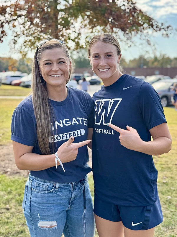 Brooks (right) went to Wingate softball games as a child, watching players like Alexis Burrell (left). (Photo courtesy of Savanna Brooks)