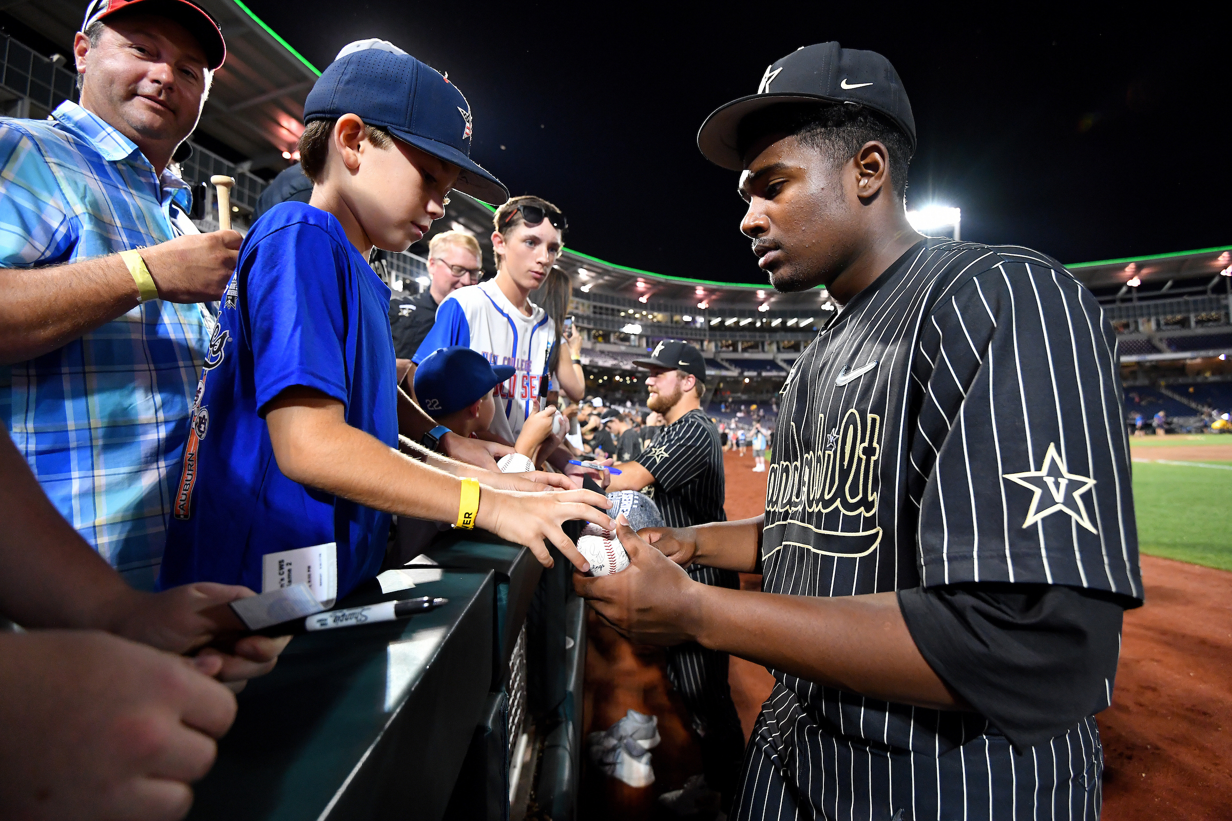 OMAHA, NE - JUNE 25: Kumar Rocker #80 of the Vanderbilt Commodores signs autographs following the Division I Men's Baseball Championship held at TD Ameritrade Park Omaha on June 25, 2019 in Omaha, Nebraska. (Photo by Jamie Schwaberow/NCAA Photos via Getty Images)