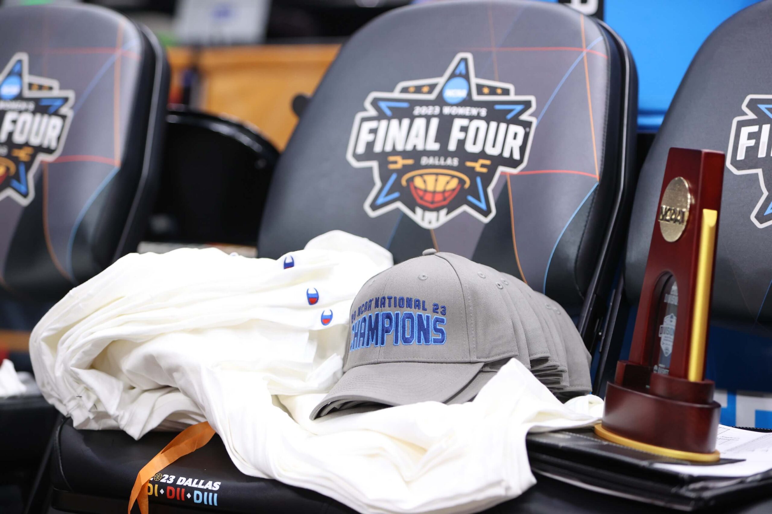 DALLAS, TX - APRIL 01: Championship shirts and hats are seen after the game between the Transylvania Pioneers and the Christopher Newport Captains during the Division III Women’s Basketball Championship held at American Airlines Center on April 1, 2023 in Dallas, Texas. (Photo by Grace Bradley/NCAA Photos via Getty Images)