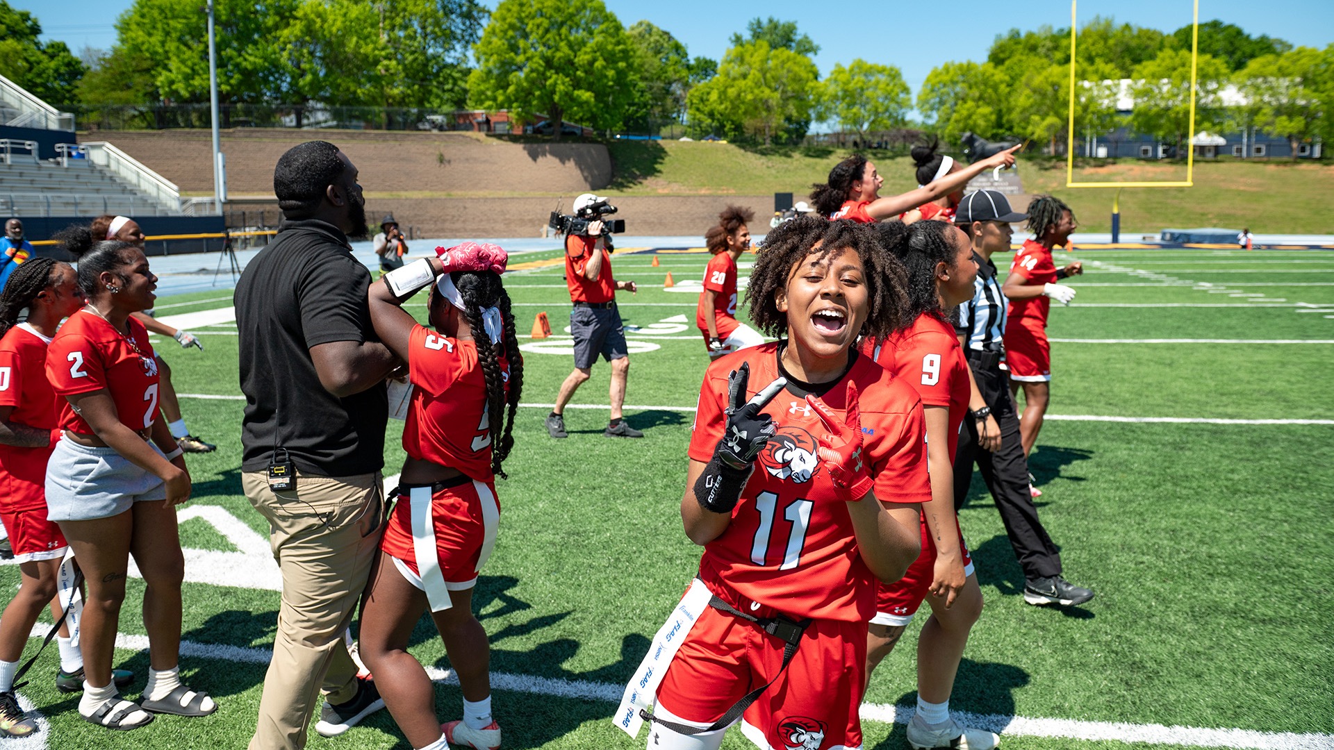 Bowman celebrates after the championship game as teammates rush onto the field. (Photo by Keith Quick / Winston-Salem State)