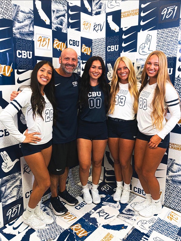 Brandon Seagondollar gathers with stunt team members (from left) Maddie Arochi, Miah Baro, Abby Eshleman and Savannah Eshleman.