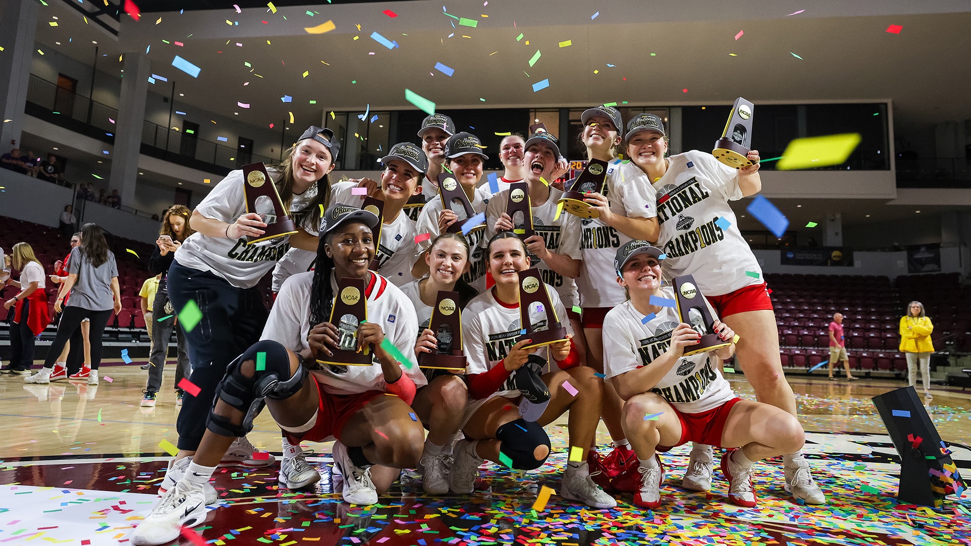 The Big Red celebrate their victory against the Scranton Royals during the Division III Women's Basketball Championship.
