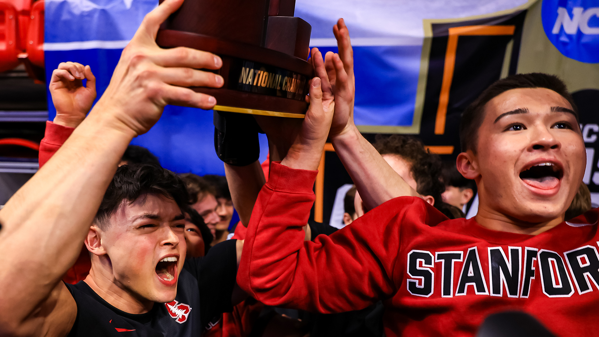 Cooper Kim celebrates with his Stanford teammates after winning the National Collegiate Men’s Gymnastics Championship. (Photo by Jimmy Naprstek / NCAA Photos)
