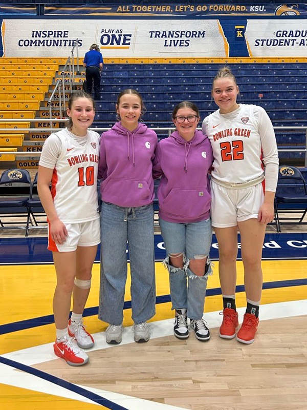 Bowling Green's Paige Kohler (left) and Lauren Gerken (right) met their pen pal after a game. "HOOPS allowed me to build a genuine relationship with a young athlete," Kohler said. "One of the highlights was getting to meet her at our game against Kent State."