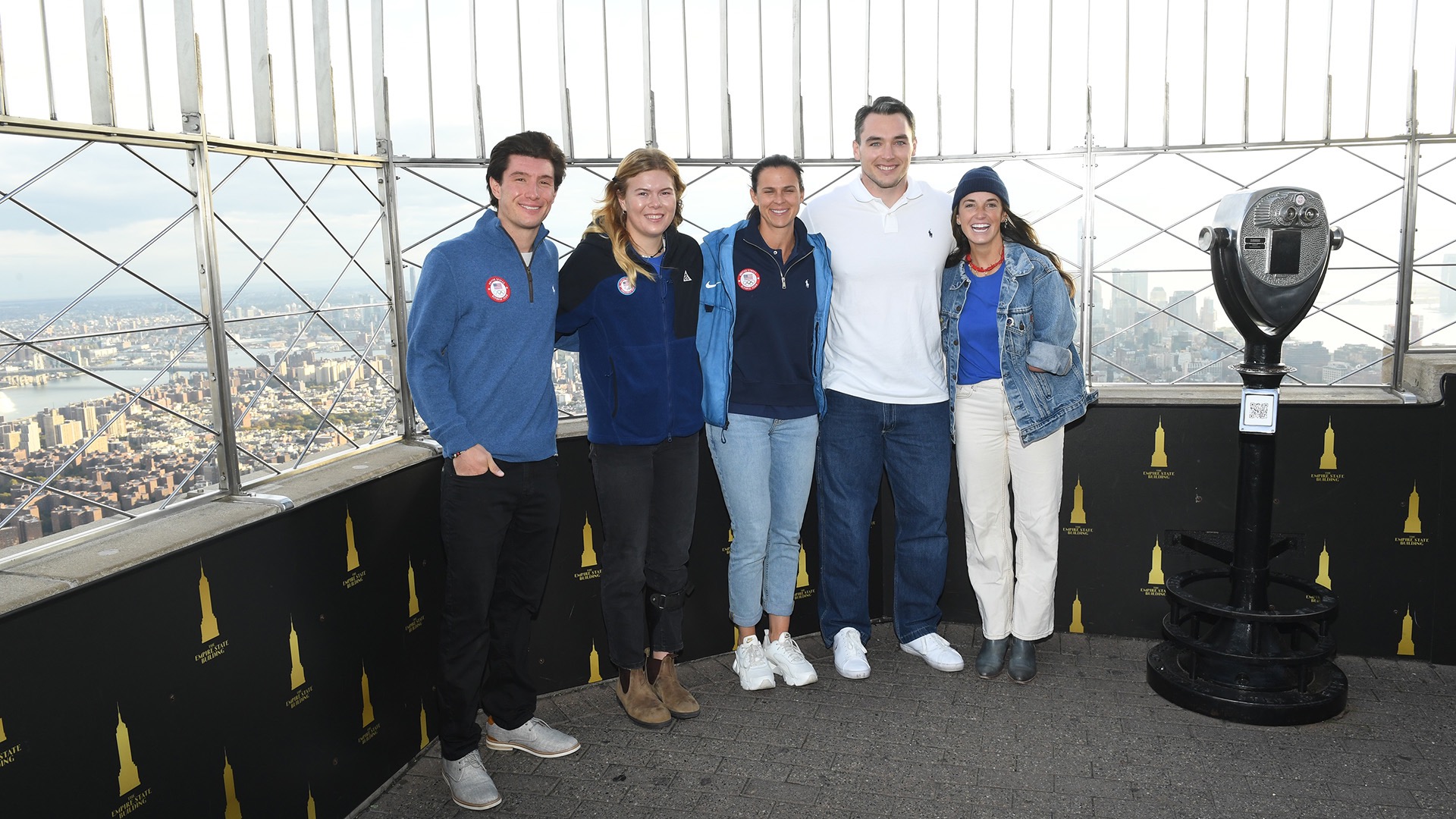 Alex Ferreira (from left), Sydney Peterson, Brittany Bowe, Jack Wallace and Dani Aravich gather at the Team USA Lights event at the Empire State Building. (Photo by Noam Galai / Getty Images)
