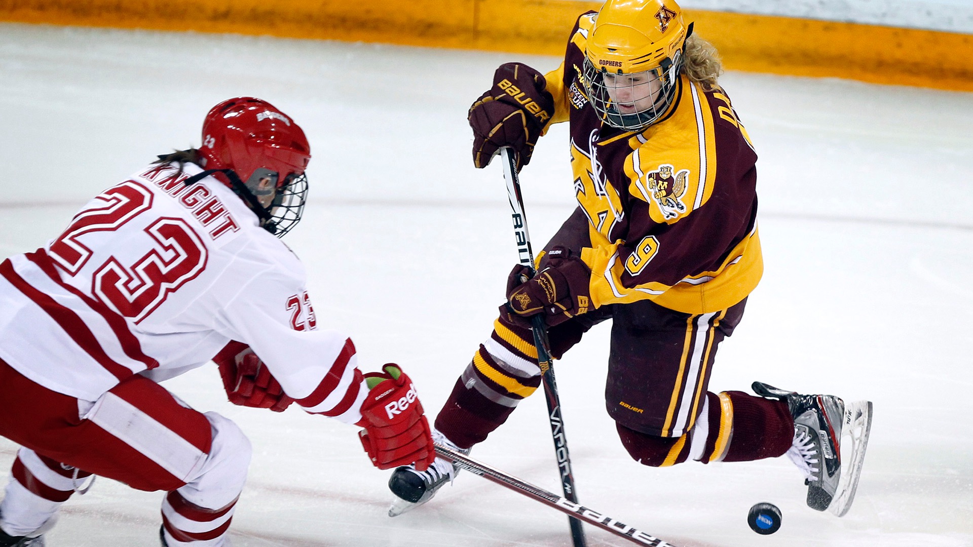 Hilary Knight fights for the puck at the 2012 National Collegiate Women's Ice Hockey Championship. (Photo by Carlos Gonzalez / NCAA Photos)