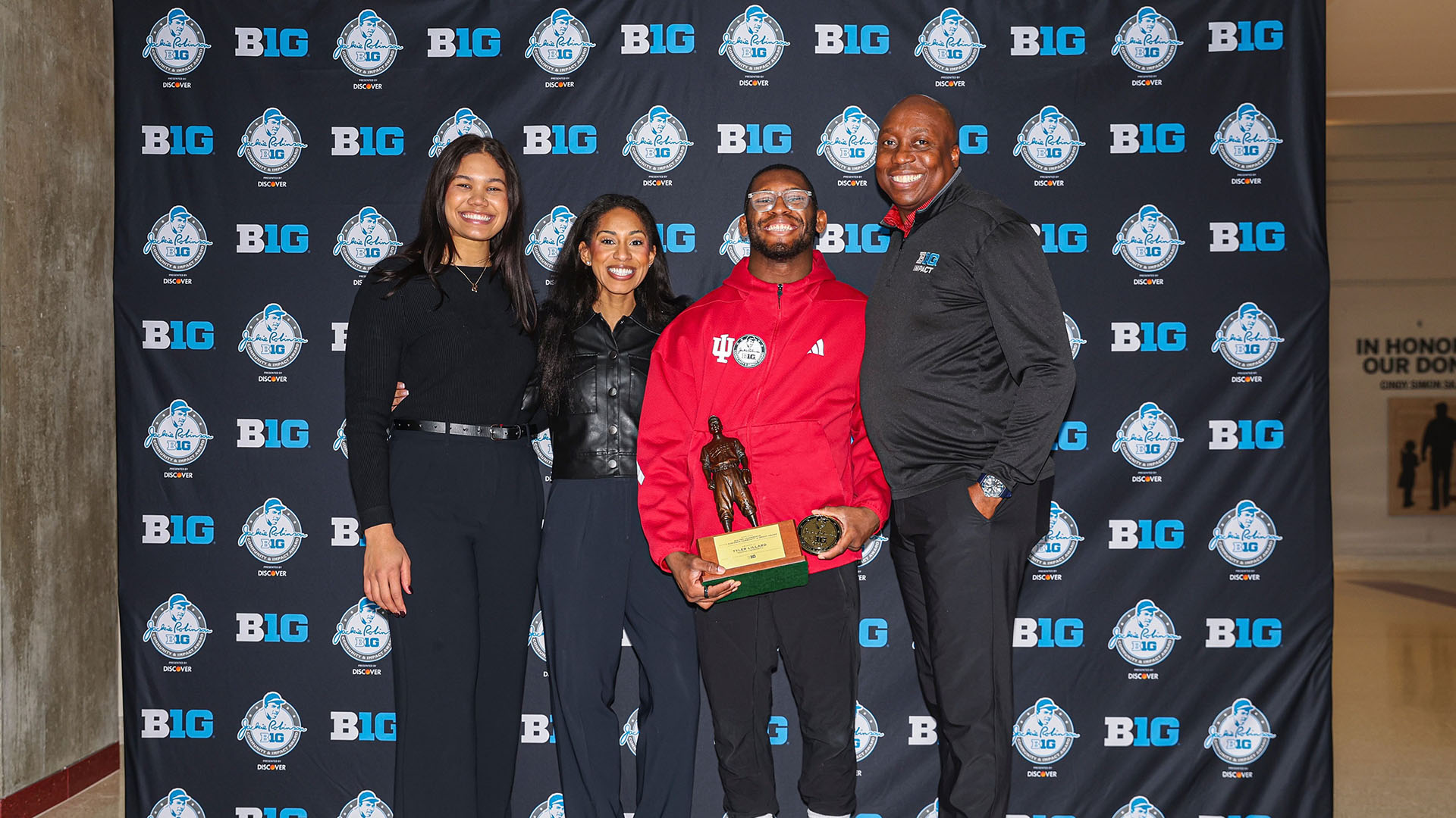 Big Ten Community & Impact team staff members Kennedi Orr (left), Mya Perez and Omar Brown (right) share a moment with Indiana’s Tyler Lillard at the 2026 Jackie Robinson Award Ceremony. (Photos courtesy of Kennedi Orr)