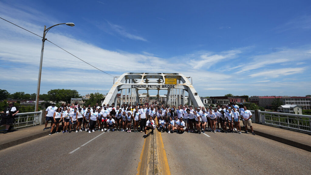 Student-athletes re-created the civil rights march across the Edmund Pettus Bridge in Selma, Alabama, as part of the Big Life Series.
