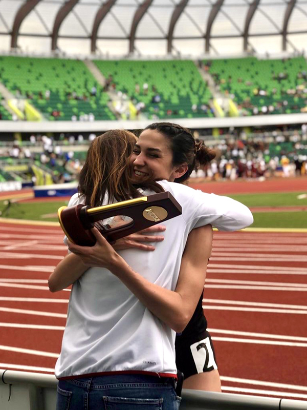 Elly Henes celebrates her 5,000-meter title with her mom and coach Laurie Henes. (Photo courtesy of NC State)